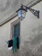 street lamp on the wall of the building