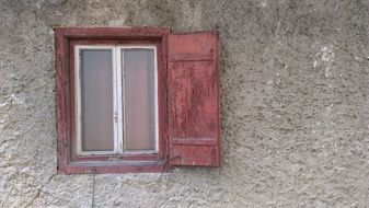 Old Wood window with pink shutters