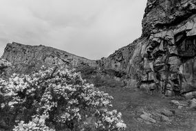 black and white photo of a rocky hill in scotland