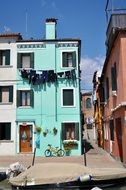 courtyard among colorful houses in the Burano district in Venice