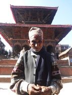 man near a temple in Nepal