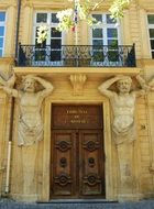 sculptures on the wall of the building near the door, france