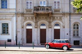 red car on the streets of budapest