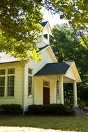 village church among green trees