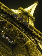 eiffel tower in the yellow light at night