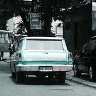 Antique cars on a street