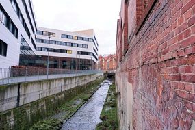 building of university of Kassel by the river