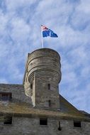 flag on a stone tower in Saint-Malo