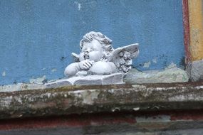 cherub on the facade of the church close-up