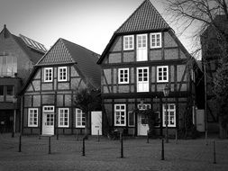 timber framed buildings in black and white