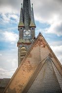 steeple with clock at sky