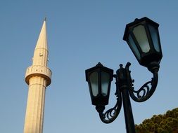 street lamp on the background of the Muslim tower
