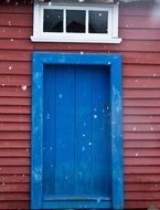 Blue door of the red building