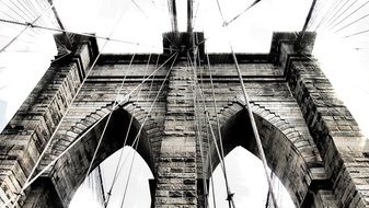 black and white photo of part of the brooklyn bridge