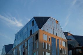 building with a glass facade on a city street