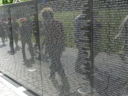 reflection of people on wall of Vietnam war Memorial, usa