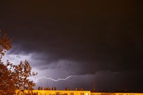 lightning in the night sky over the city