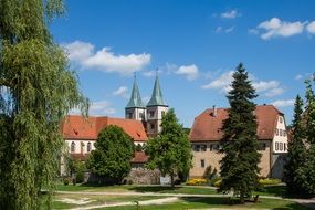 city church and houses among the firs