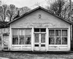 Black and white photo of a wooden shack