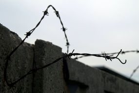 barbed wire over a prison fence in Lithuania