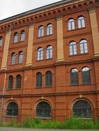 Old red brick four-storey building, detail