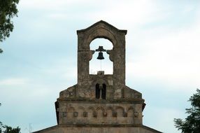 church in romanesque style on beautiful sky background