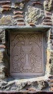 engraving with a peacock in a church in cyprus