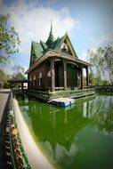 buddhist temple on green water