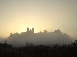 castle in the distance in the morning haze