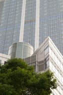 glass and stone facade of a modern skyscraper