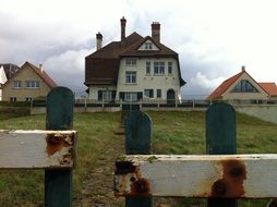 white house on the coast in belgium