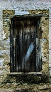 Aged rusty door in old town
