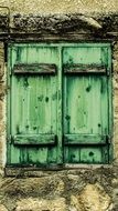 green wooden window shutters of a house in oroklini