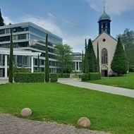 church near contemporary building, germany, baden-baden