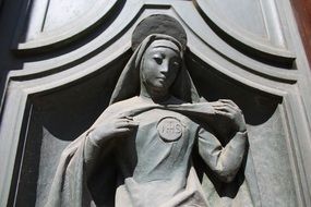 stone statue on the facade close up