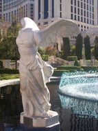 sculpture of an angel near the fountain