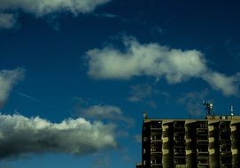 white clouds over the house