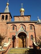 red brick orthodox church in Russia