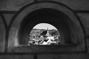 view of the city through the arch, black and white, czech, krumlov