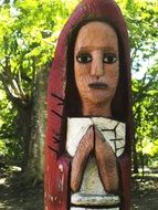 praying woman, wooden sculpture in Park, dominican republic, Engombe