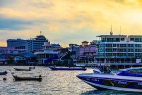 boats on sea in harbor at Sunset