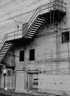 black and white photo of the stairs on the building