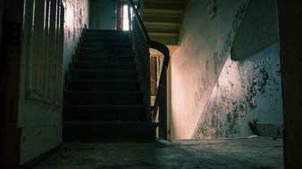 abandoned staircase of a dilapidated building