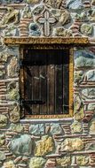 wooden window in a traditional stone house in cyprus