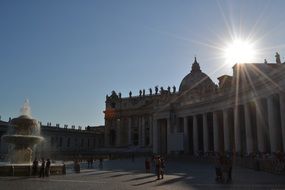 bright sun over square in rome