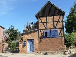 half-timbered red brick house at countryside