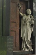 statue of a woman in a cemetery