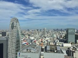 modern skyscrapers in Japan under blue sky with white clouds