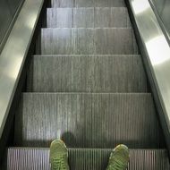 passenger descent on the escalator in the subway