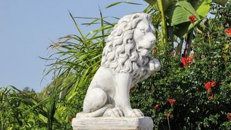 white stone lion as a decoration of the park